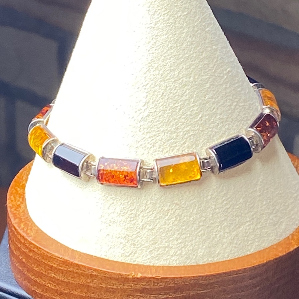 925 SS Amber bracelet with cherry and butterscotch amber, 7.5”long retail $285.
